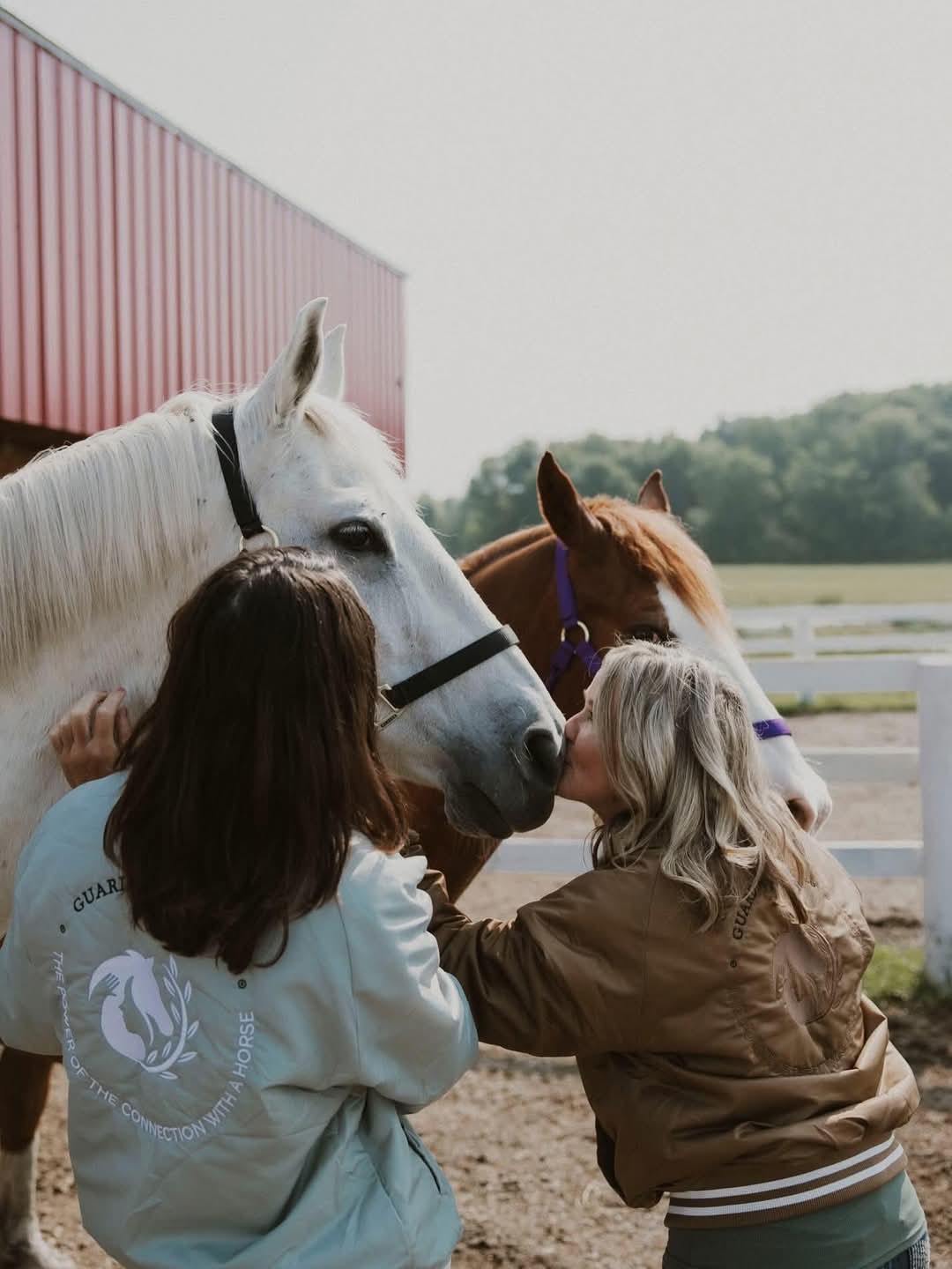 A tender moment sharing a kiss with a horse
